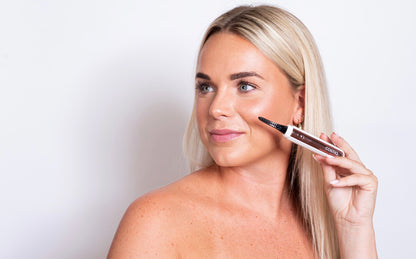 Heated eyelash curler in use